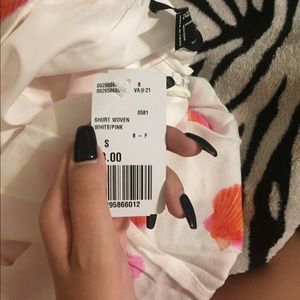 White shorts with pink seashells